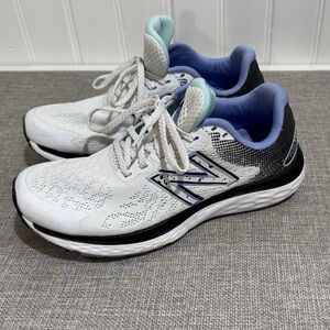 New Balance Women’s White and Black Sneakers with Blue Accents